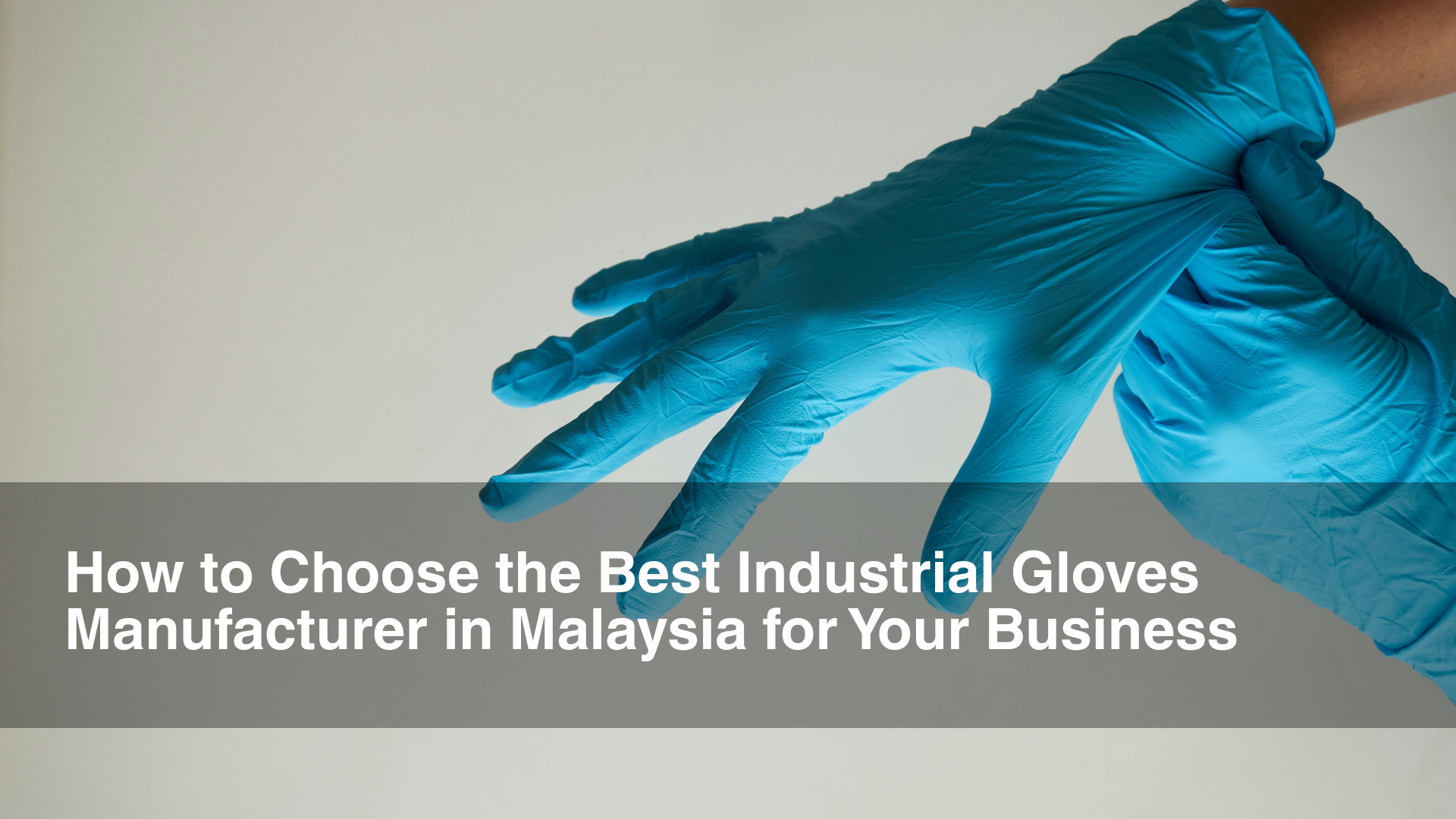 Man wearing blue industrial gloves manufacturer Malaysia